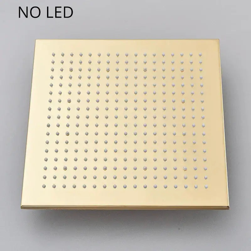 Modern gold led rainfall shower head with square design and evenly spaced rounded nozzles by decorbites gold led