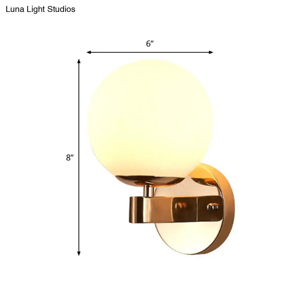 Modern gold opal glass wall light with frosted globe and gold finish suitable for e26 e27 bulbs in living room
