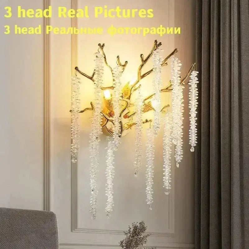 Modern gold round crystal branches chandelier features a gold-toned branch wall sconce with cascading clear crystals