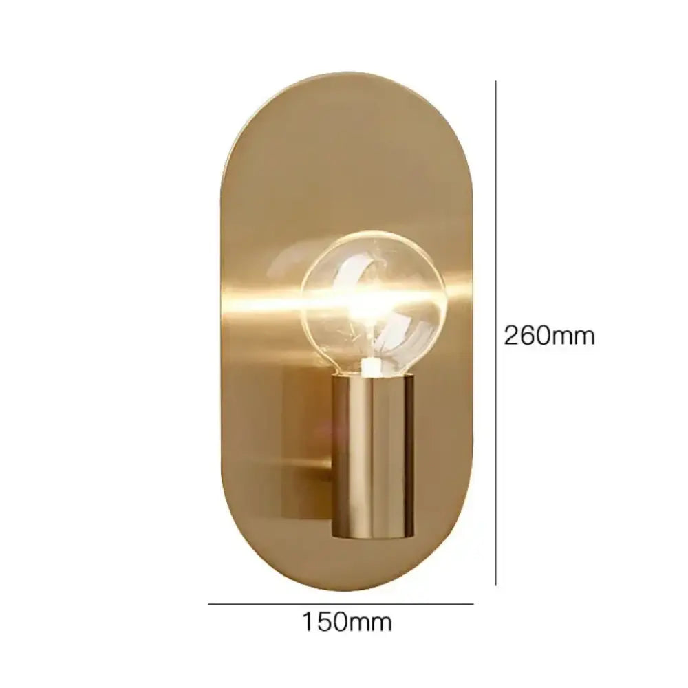 A modern gold wall lamp sconce in brushed brass with a cylindrical stem and clear filament bulb for bedroom decorbites wall lamp