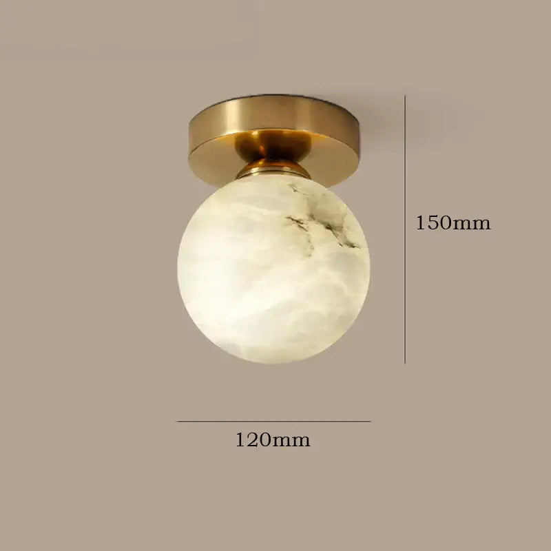 Modern golden brass ceiling lamp with off-white opal glass globe and subtle gray veining for bedroom decorbites golden brass