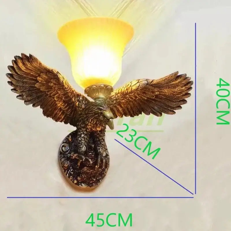 Modern golden eagle crystal led wall lamp bronze eagle sconce with outstretched wings and warm yellow glass shade