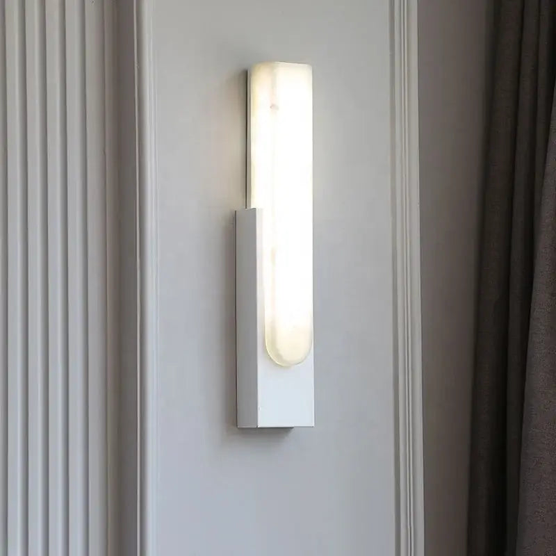 Modern white rectangular wall sconce with frosted glass diffuser emitting warm light for decorbites grey marble led bedside use