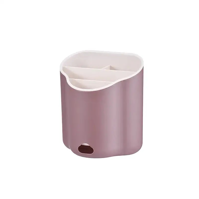 A sleek matte rose gold plastic double layer cutlery holder with white interior and three compartments for kitchen organization