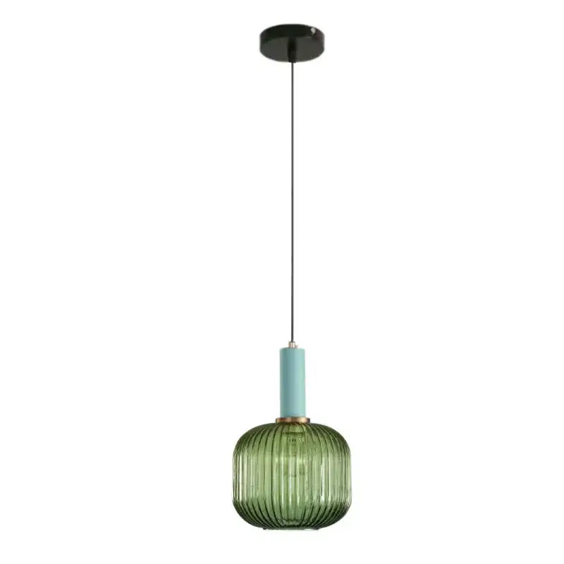 Modern ribbed green pumpkin glass pendant lights with a matte teal neck and black ceiling mount for dining room decorbites decor