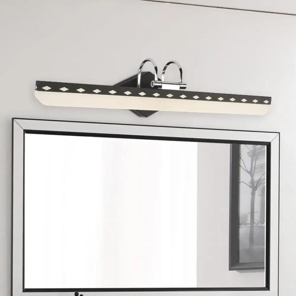 Modern black and chrome led vanity light with curved arm and diamond cutouts for natural light in black white bathroom