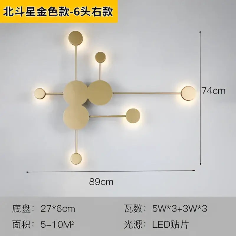 Gold-colored modern geometric wall lamp with six circular LED lights in a starburst pattern from decorbites creative line rgb