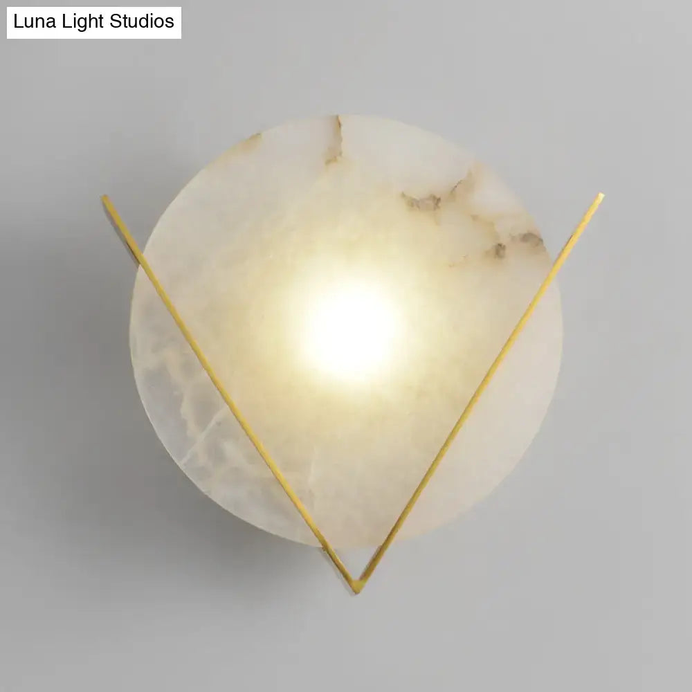 Post modern white marble and gold wall light sconce with round panel wall featuring translucent onyx disc and gold arms