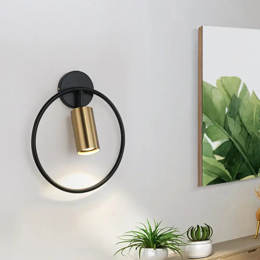 Postmodern gold halo ring wall sconce with sleek black and gold design in 16 inches fixture height for bedroom use