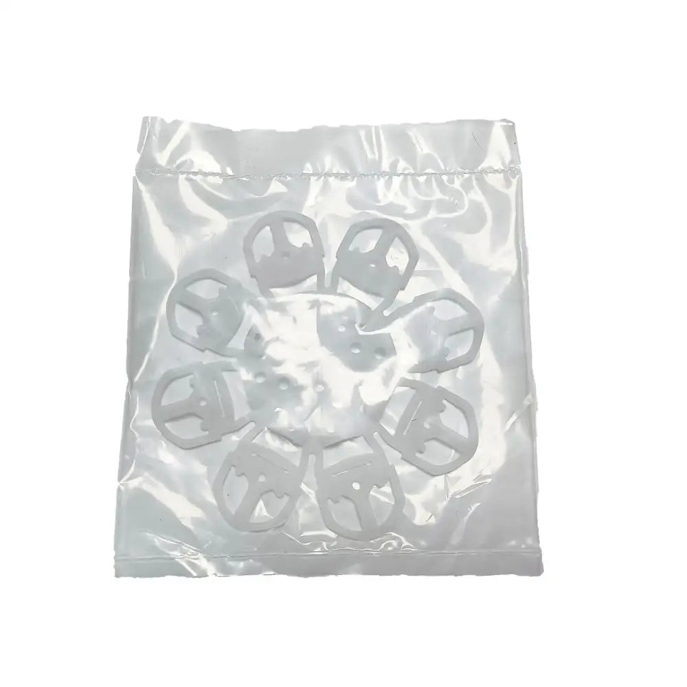 White plastic clip-style fasteners in clear bag for red and black espresso coffee machine brush cleaning tool