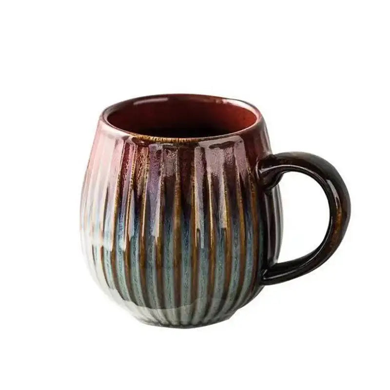 Retro japanese ceramic coffee mug with vertical ribbed texture and gradient glaze from deep brown to blue gray tones