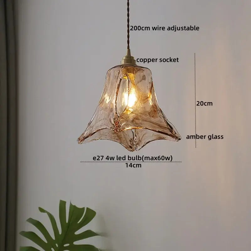 A bell-shaped clear glass led pendant light with amber texture and copper socket by decorbites with adjustable wire