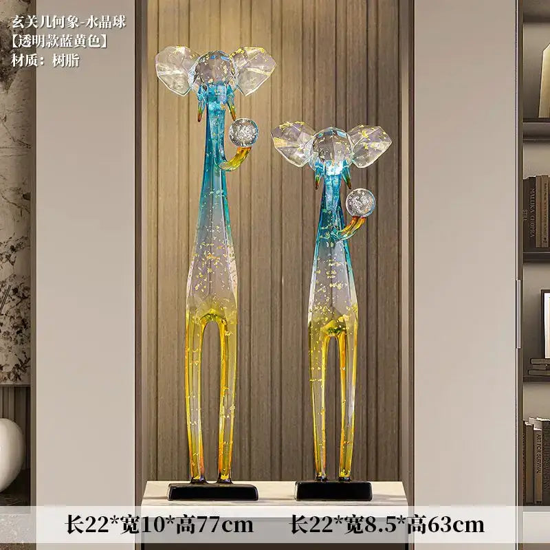 Translucent blue and yellow resin giraffe floor decoration sculpture with crystal ears and spherical trunk ornament for living room