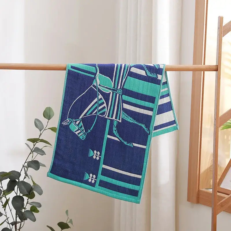 Navy blue and teal cotton gauze hand towel with stylized horse design from decorbites cotton gauze face towel set