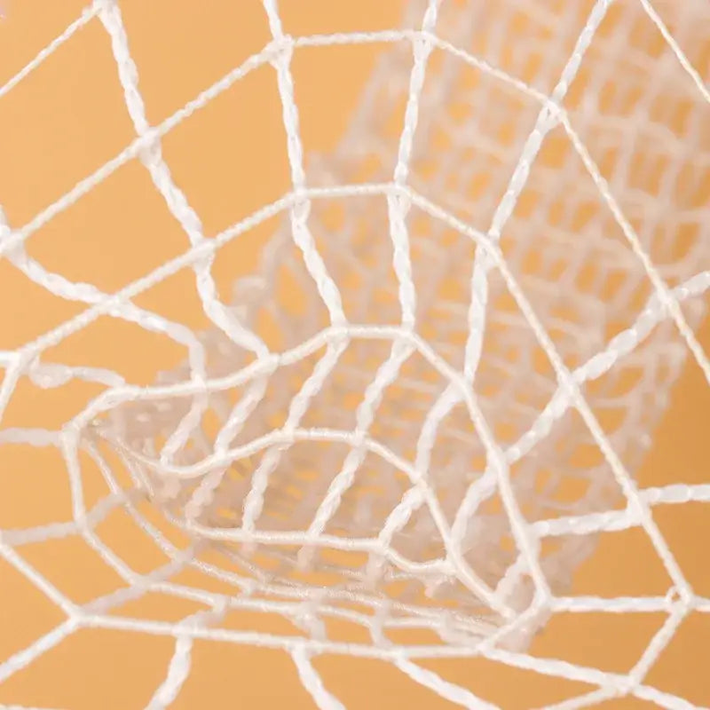White butcher’s string roll meat mesh netting featuring a woven textured design for kitchen display purposes