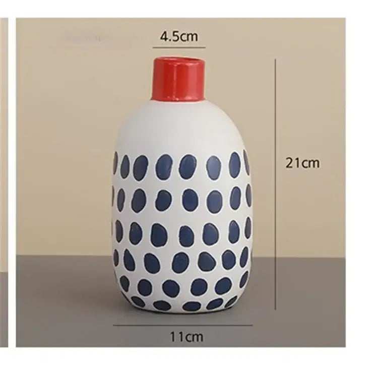 White ceramic polka dot vase with colorful graffiti lines, navy blue dots, red lid, 21cm tall for living room display