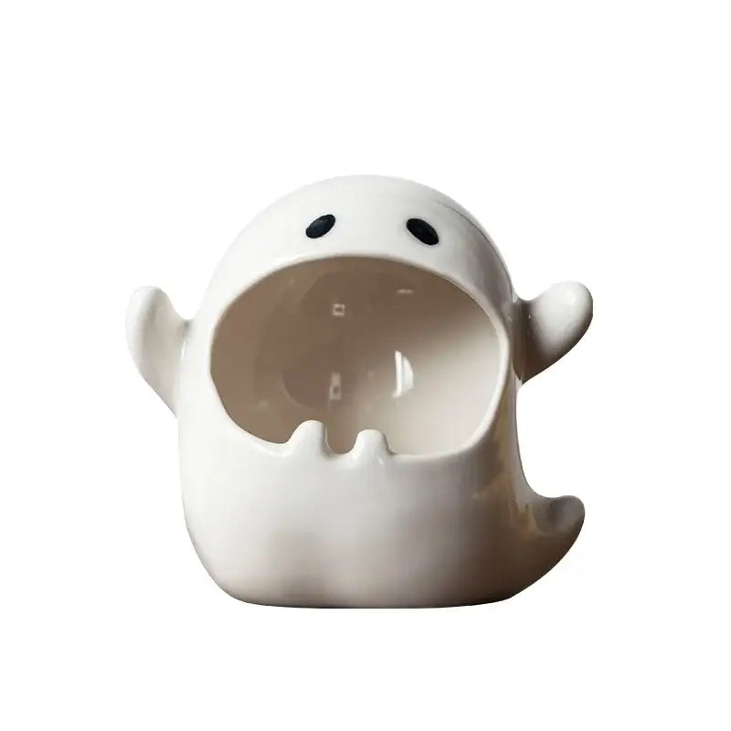 White ceramic ghost genie halloween porcelain ashtray shaped like a ghost with black dot eyes and wide open mouth