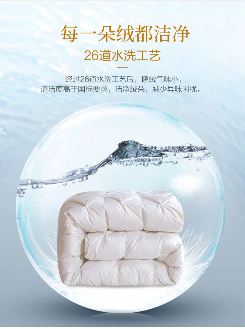 A plush off-white 100 percent white goose down comforter with soft quilted texture and subtle stitching details