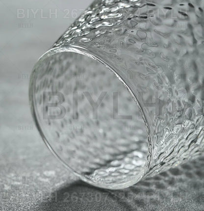 Clear glass tumbler with textured hammered surface included in transparent hydroponic glass flower pot set with base tray