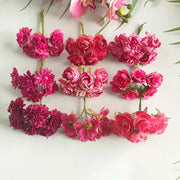A 200pcs mixed rose red artificial flower stamen bundle with varied petal textures and green stems arranged in rows