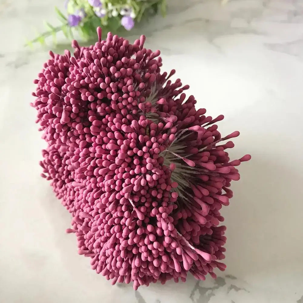 A dense rounded bouquet of 200pcs mixed rose red fuzzy-tipped craft pins for flower stamen bedroom diy decor