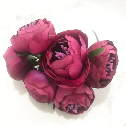 A cluster of deep magenta 200pcs mixed rose red fabric peonies with purple stamens and green stems for diy decor