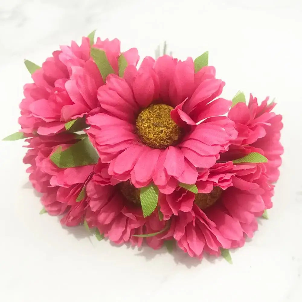 A cluster of vibrant pink artificial daisies with golden centers from a 200pcs mixed rose red flower stamen bundle for decor