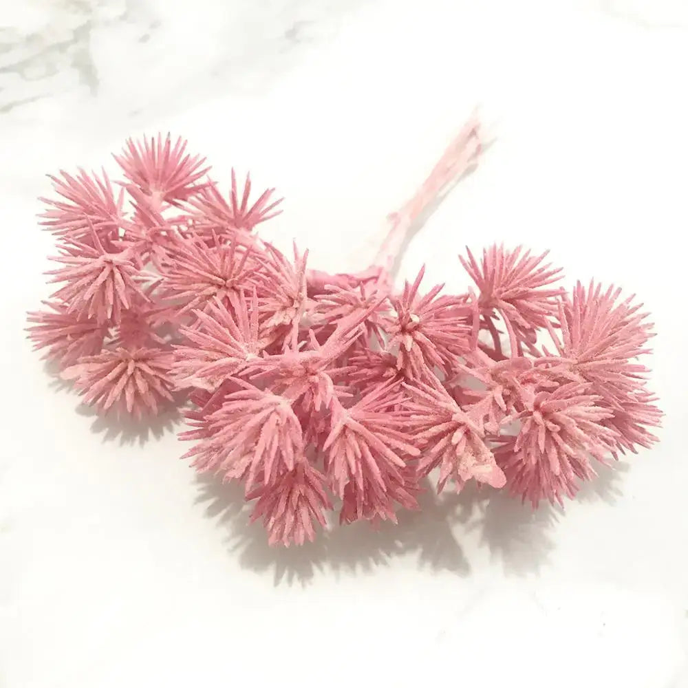 Pink artificial flower cluster with spiky textured petals and central stem from 200pcs mixed rose red flower stamen bundle