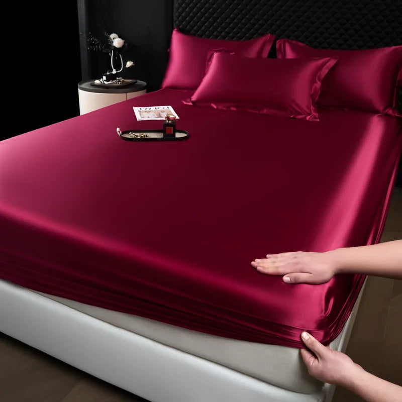 Luxurious burgundy satin fitted sheet from a 3 pcs high end 100% mulberry silk sheet set with smooth glossy finish