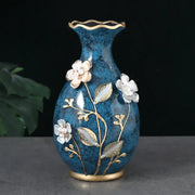Glossy teal ceramic vase with gold-trimmed fluted rim and base, white floral appliqués for dried flowers display