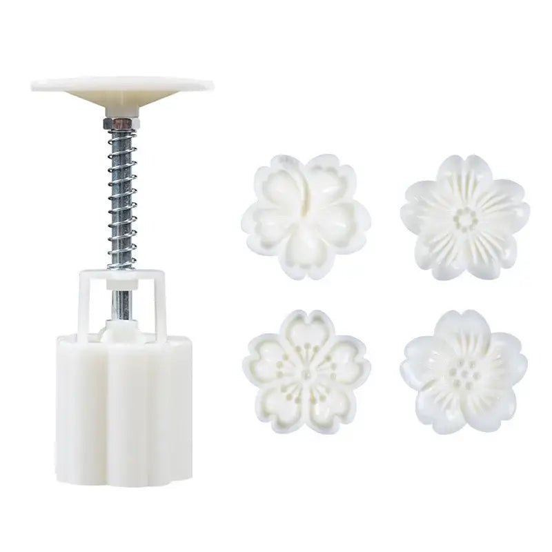 White plastic flower-shaped cherry blossom mooncake press with four matching floral molds by decorbites 3d cherry