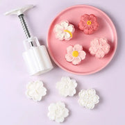 White plastic flower-shaped cherry blossom mooncake mold with spring-loaded handle and metal compression for baking decorbites 3d cherry