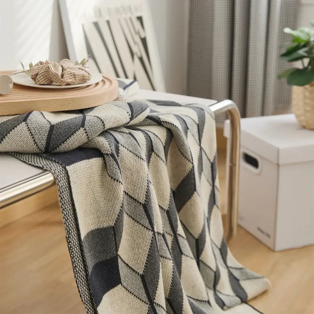 A cozy cube cotton knitted plaid blanket in black beige with a geometric diamond pattern for bedroom decorbites throw