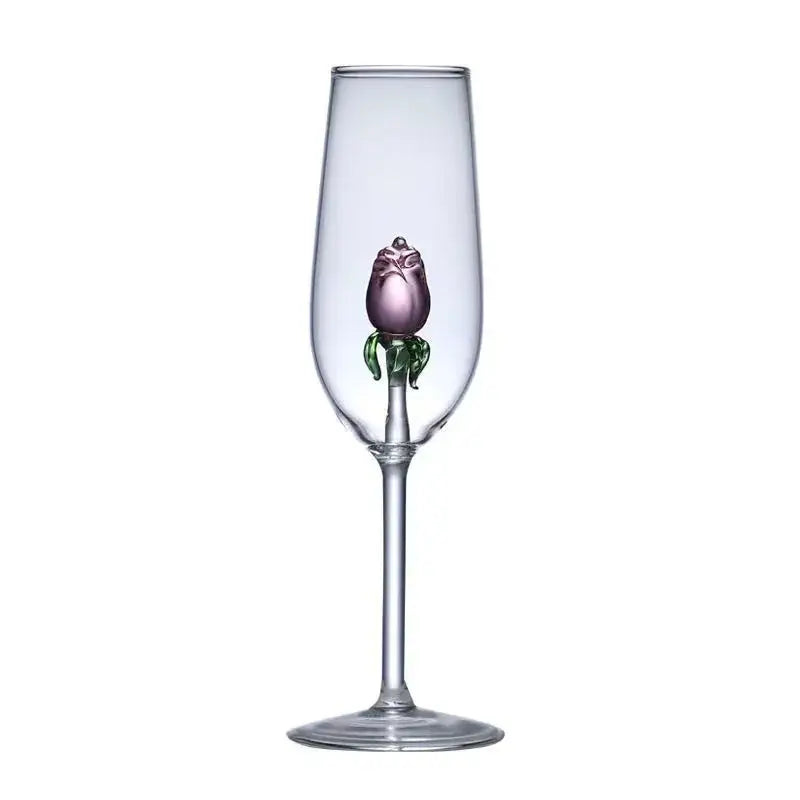 A clear glass wine goblet with a hand-blown purple glass rose and green leaves in the stem from decorbites 3d pink