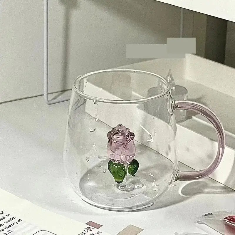 Clear glass breakfast cup with decorbites 3d rose and green leaves embedded in a pink rose glass breakfast mug