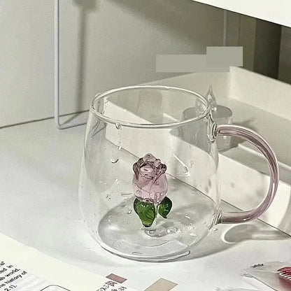 Clear glass breakfast cup with decorbites 3d rose and green leaves embedded in a pink rose glass breakfast mug