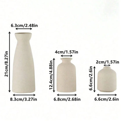 Set of three minimalist off-white ceramic vases with smooth matte finish for modern bohemian farmhouse decor