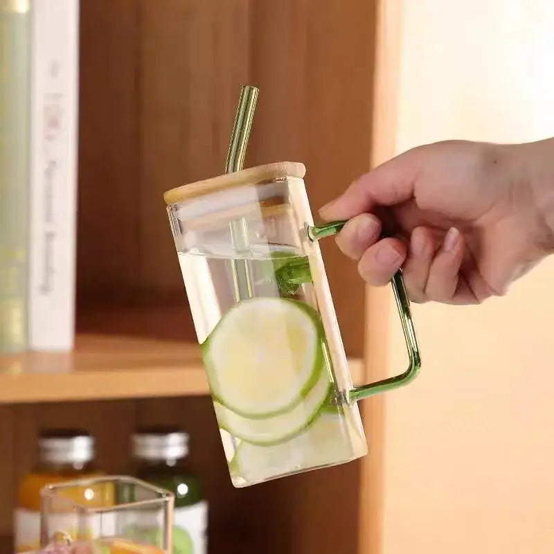 400ml square glass mug with green handle and bamboo lid filled with water and lime slices for dining room use