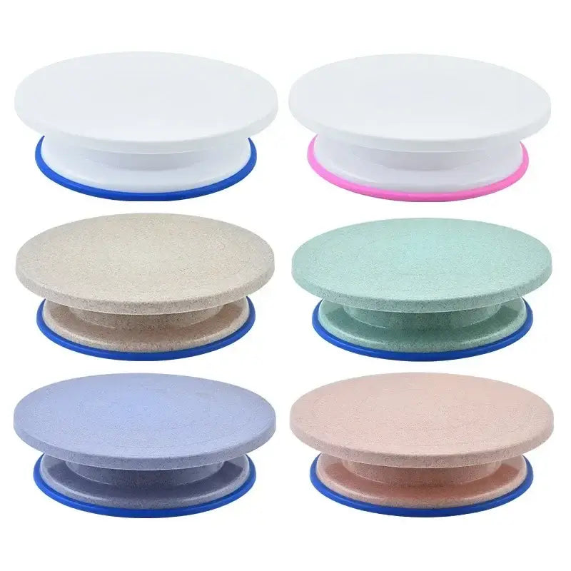 Six colorful round plastic cake decorating turntables with blue bases from the decorbites cake decorating set