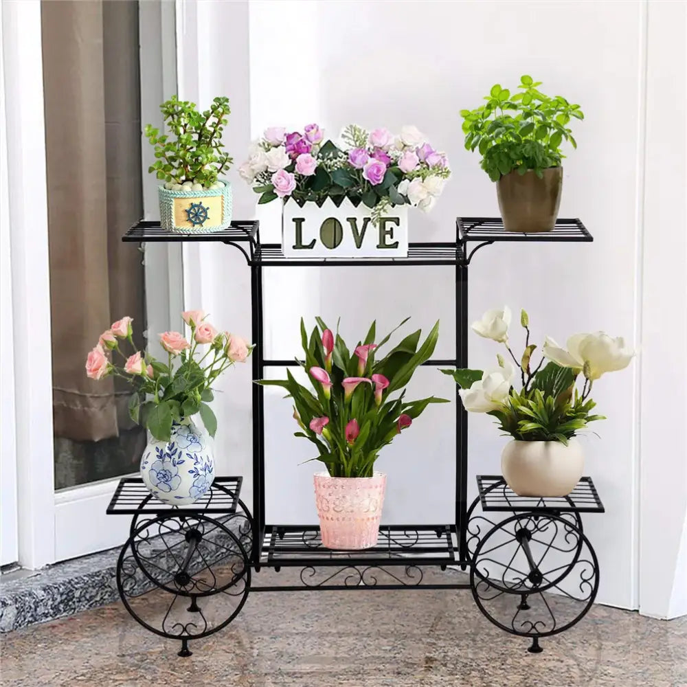 Black wrought iron DecorBites™ 6-tier metal plant stand with decorative wheels for indoor and outdoor plants