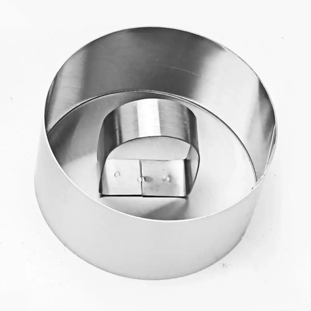 Shiny stainless steel bakeware mold with round cake ring and hinged lid in 9 piece stainless steel bakeware set