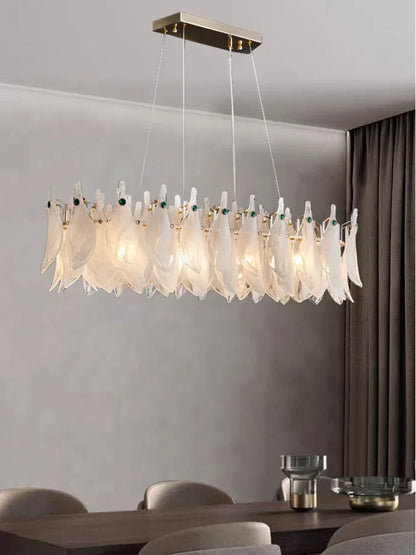 Modern chandelier with feather-like design in a room setting