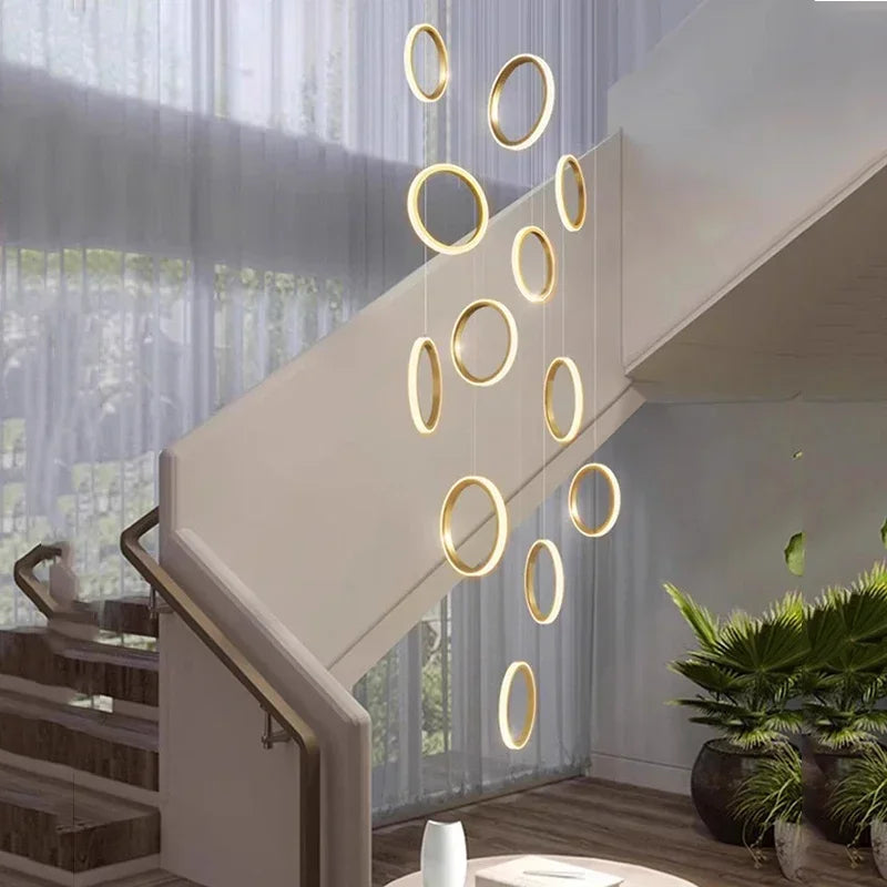 Golden circular decorbites led pendant lights in a modern minimalist arrangement for living room and dining area