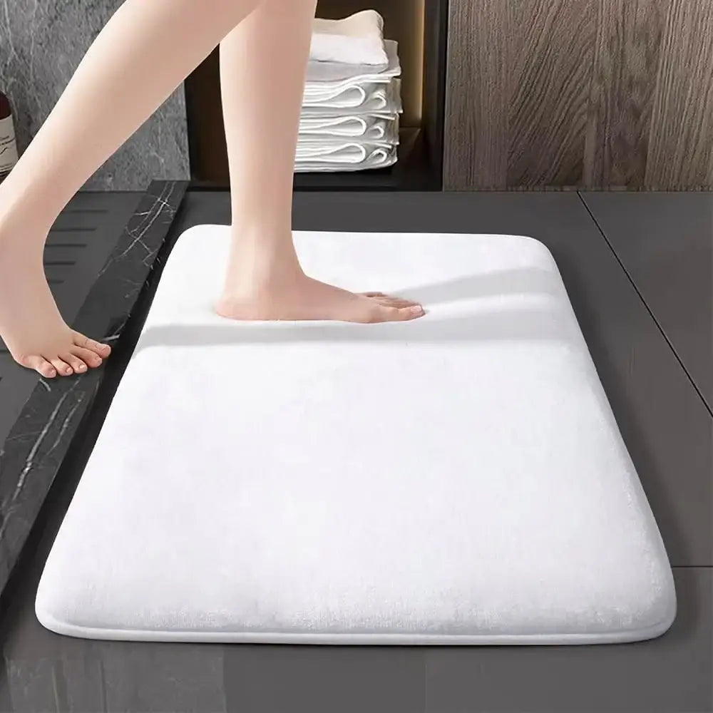 White plush coral velvet bathroom door mat with soft textured surface and rounded edges by decorbites velvet floor mat
