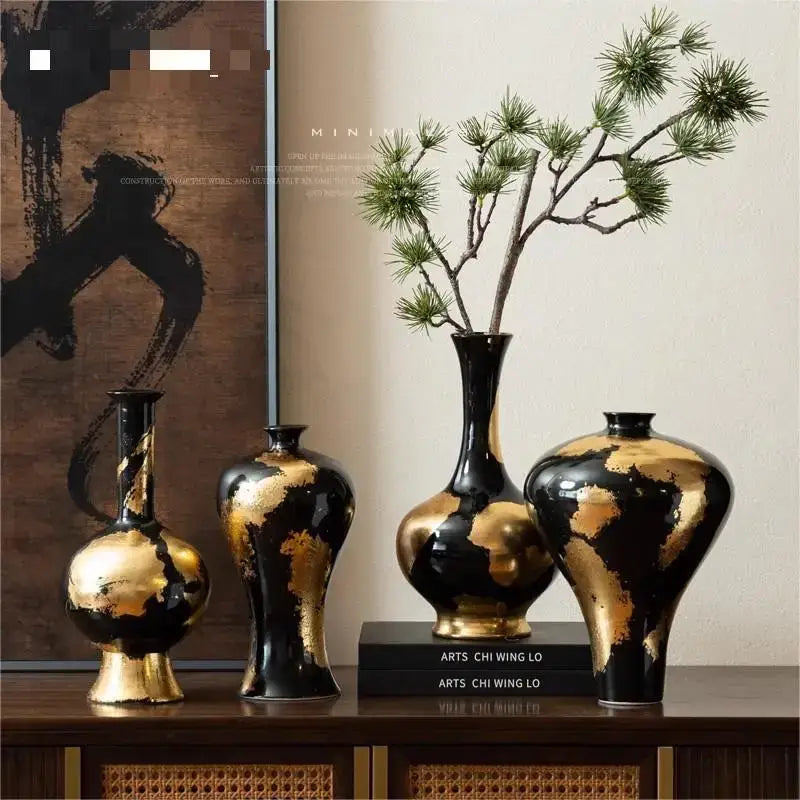 Set of four black ceramic vases with elegant gold foil pattern and glossy finish for living room decor