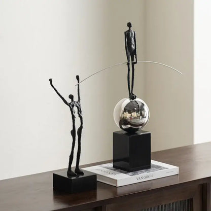 Abstract black and silver human figure sculpture with slender form on reflective sphere for living room decorbites human figure