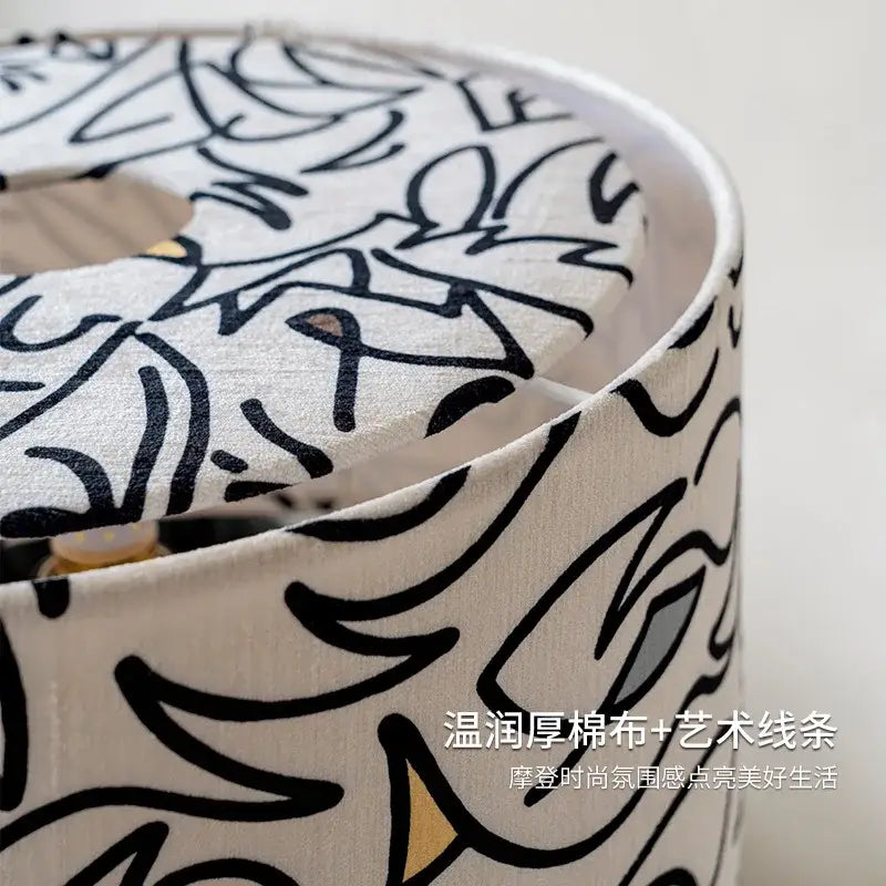 Abstract black and white study lamp with off-white cotton shade and bold black floral art decorbites designer french medieval