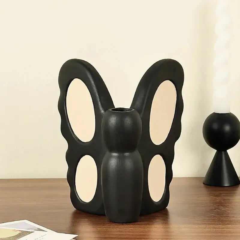 Abstract black butterfly ceramic vase with cut-out wings and central opening for living room decorbites black butterfly decor