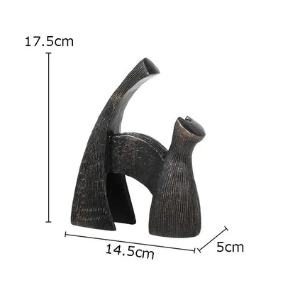 Dark bronze abstract cat sculpture with textured ribbed surface complements decorbites bull statue metal living room decor