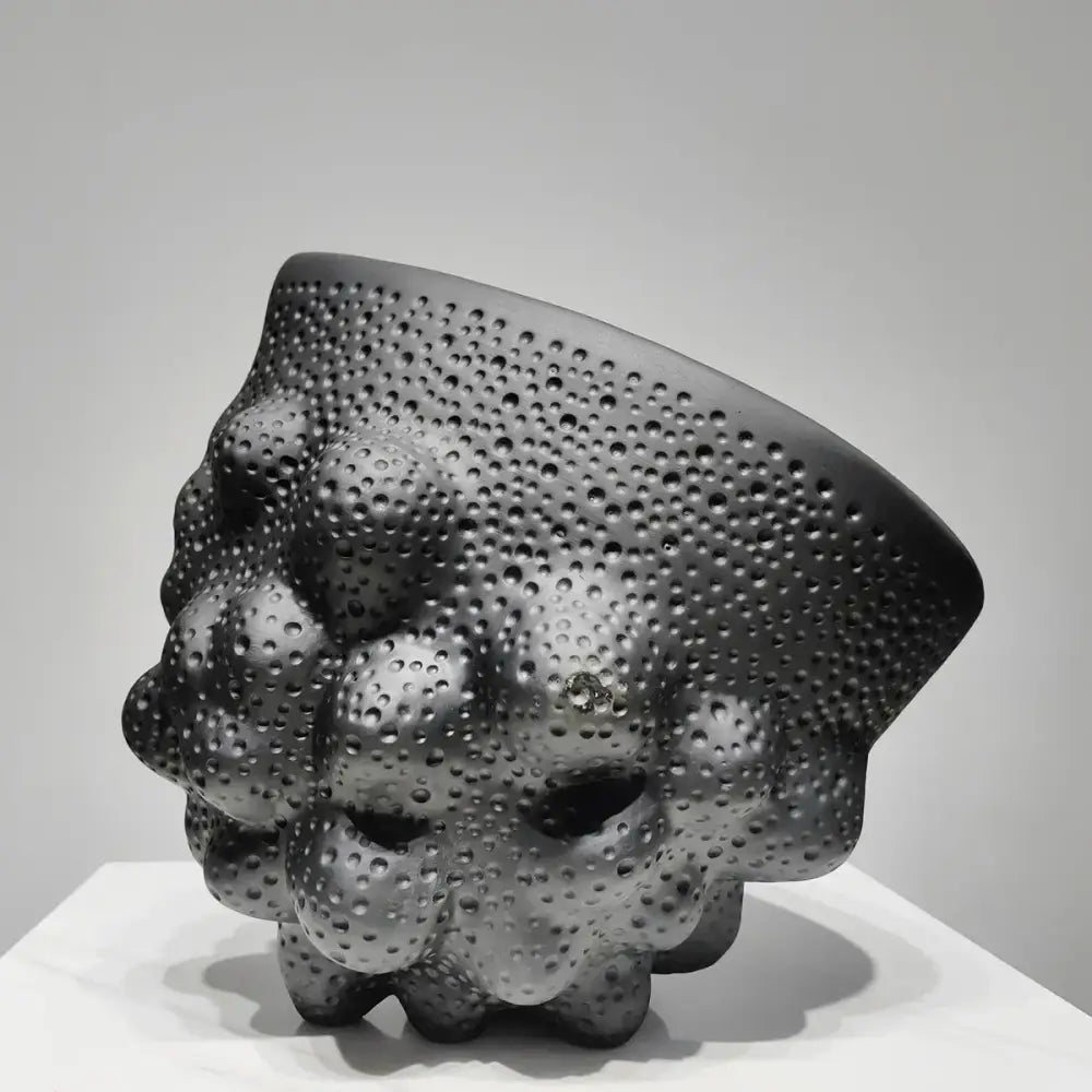 Matte black ceramic pleated vase with textured raised bumps and embedded dots for modern decorbites black ceramic decor